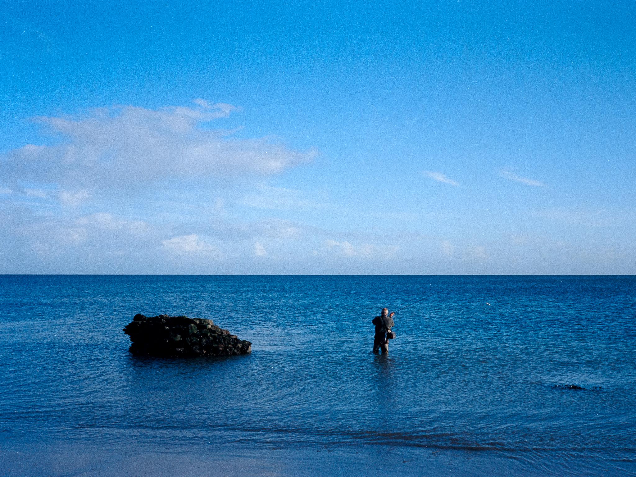 Fishing alone at sunrise