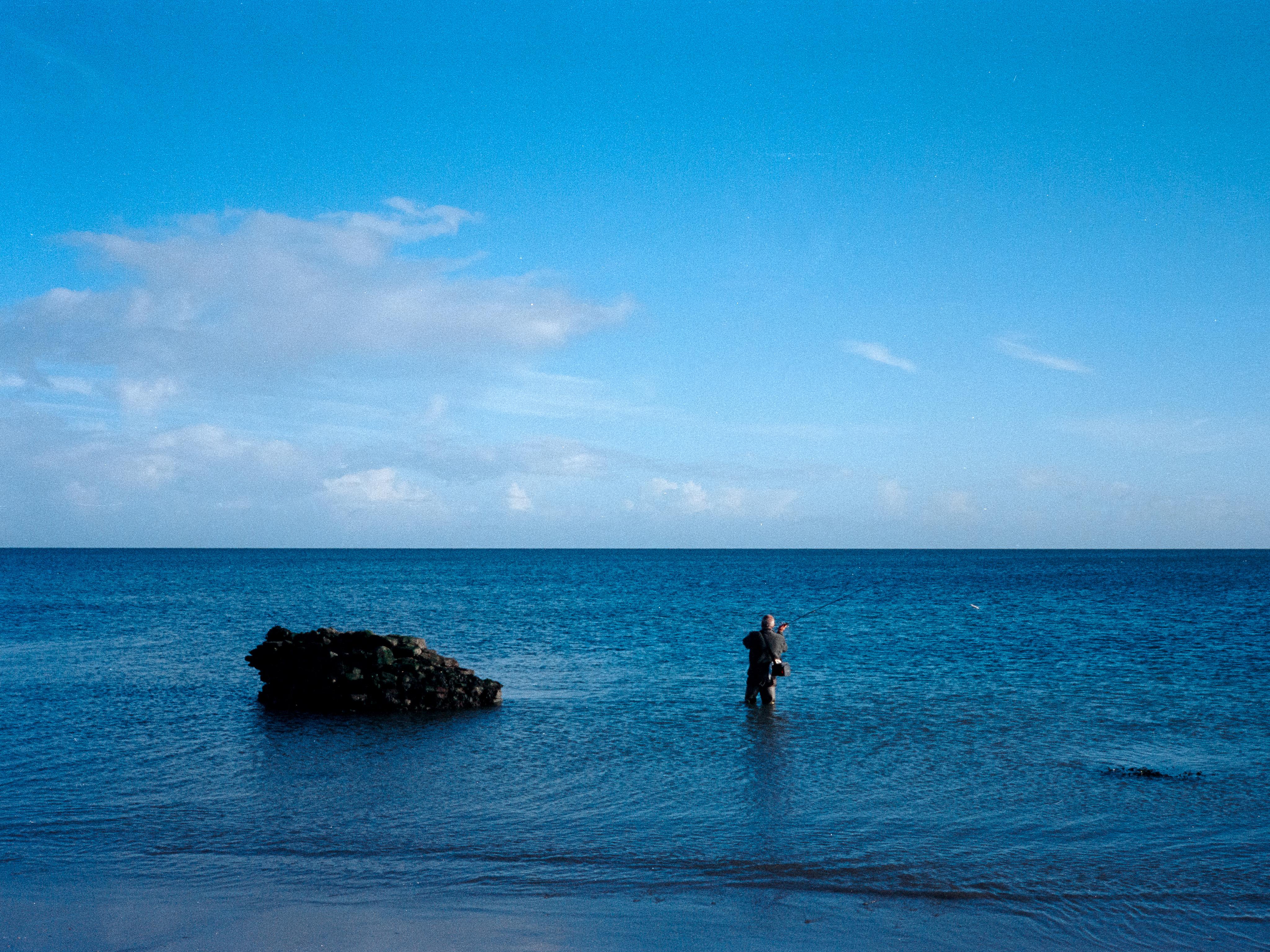 Fishing alone at sunrise