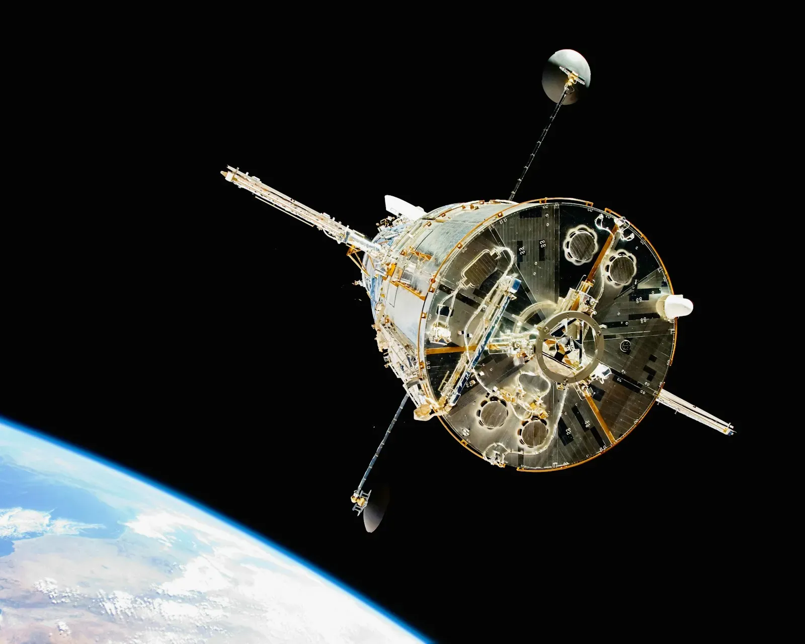 The Hubble telescope in orbit above Earth (photo by NASA on Unsplash)